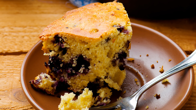 Blueberry buttermilk cornbread on a plate with fork