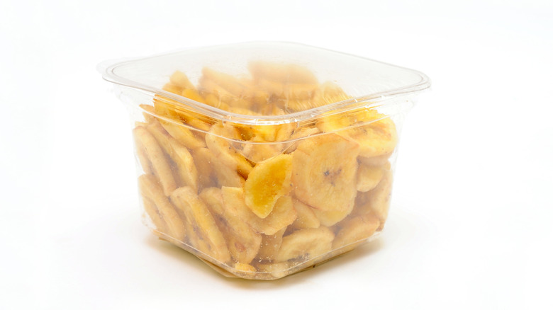 A clear container full of sliced banana
