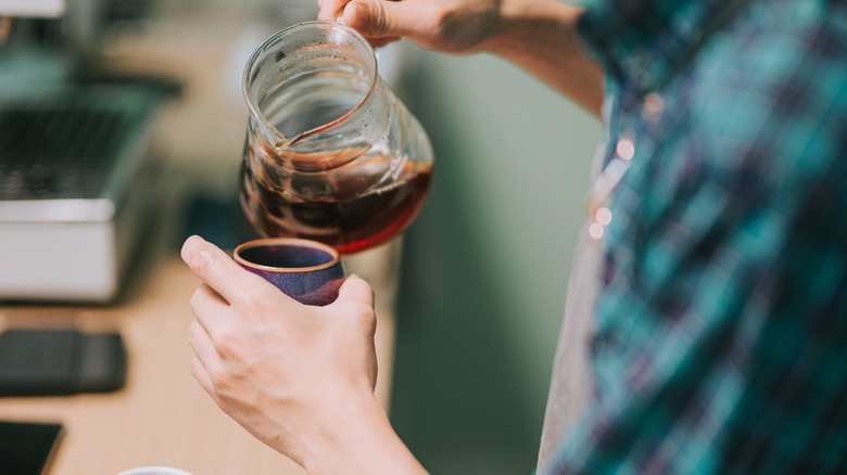 pouring coffee out of pitcher