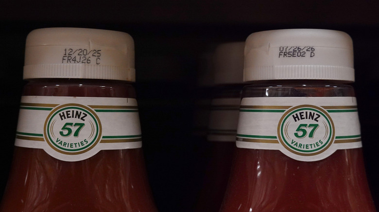 The necks of Heinz ketchup bottles showing the 57 label