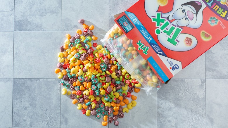A top down view of a pile of Trix cereal spilling out of the package.