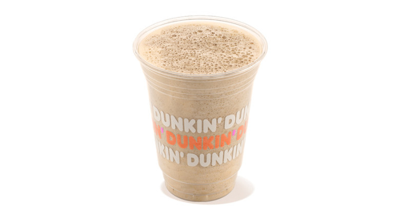 Plastic cup of Dunkin' frozen chai latte