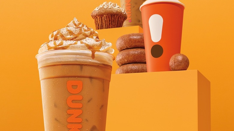 Dunkin' pumpkin products on orange background