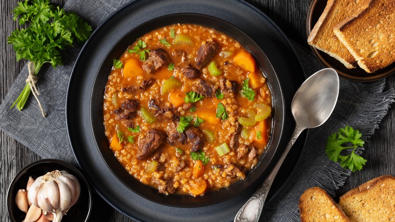 A bowl of beef barley soup