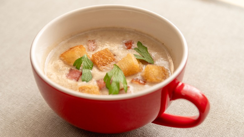A red mug of chestnut winter soup