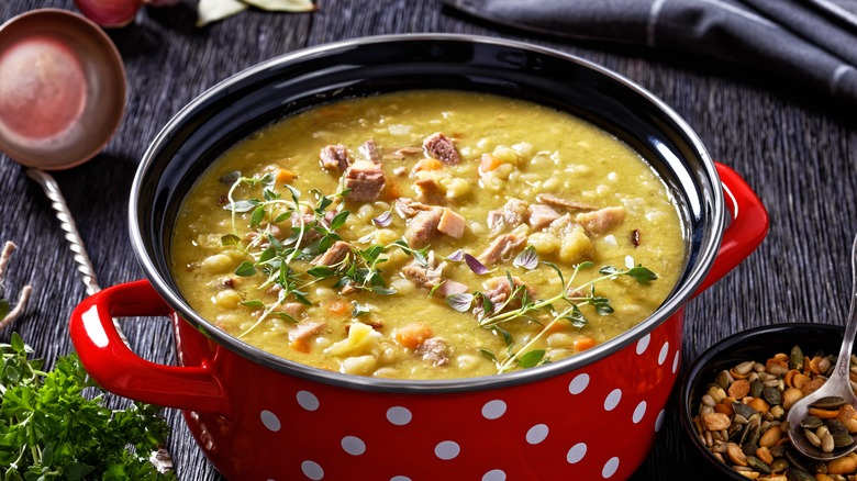 A red and white polkadot pot full of split pea soup