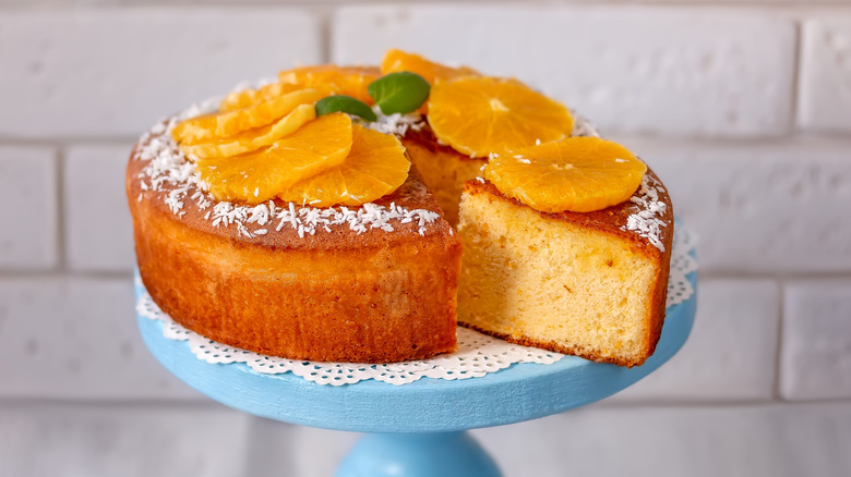 orange chiffon cake on blue cake stand.