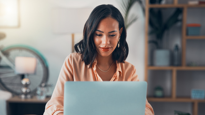 woman looking at laptop screen