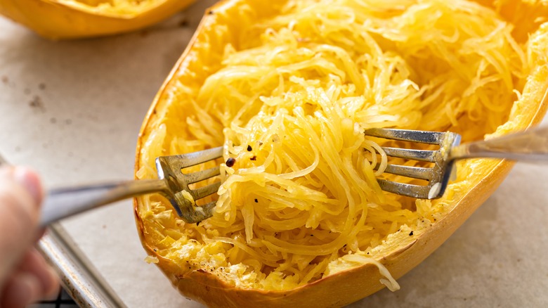 Spaghetti squash baked and pulled apart with two forks