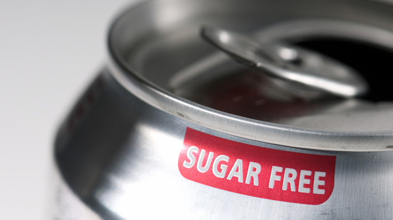 A close up of a soda can with the words sugar free on it