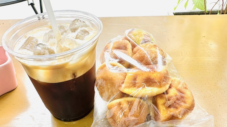 vietnamese iced coffee with bag of snacks