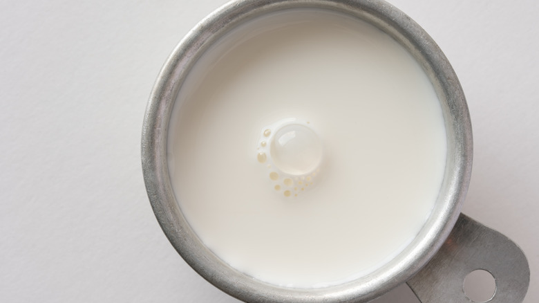 measuring cup with cream
