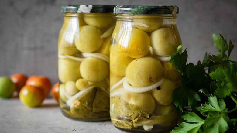 Jars of pickled green tomatoes