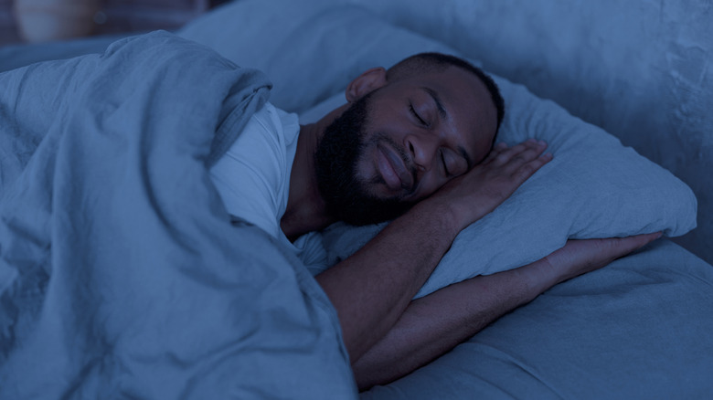 Man sleeping in bed