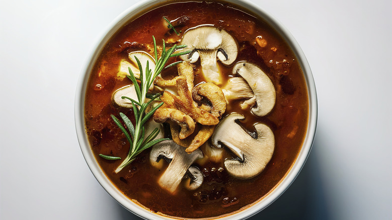 Mushroom soup with a sprig of rosemary
