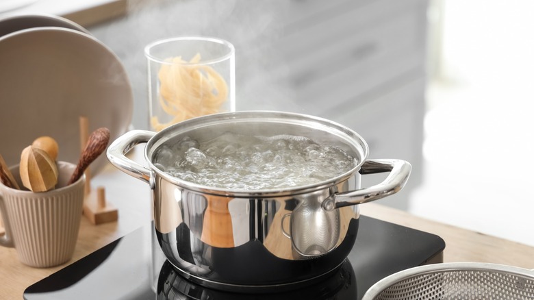 water bubbles in a boiling pan on stovetop