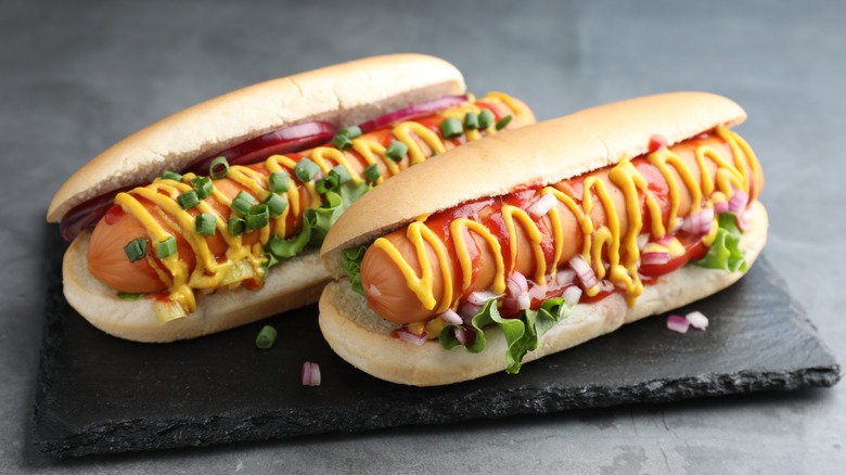 hot dogs with condiments and toppings