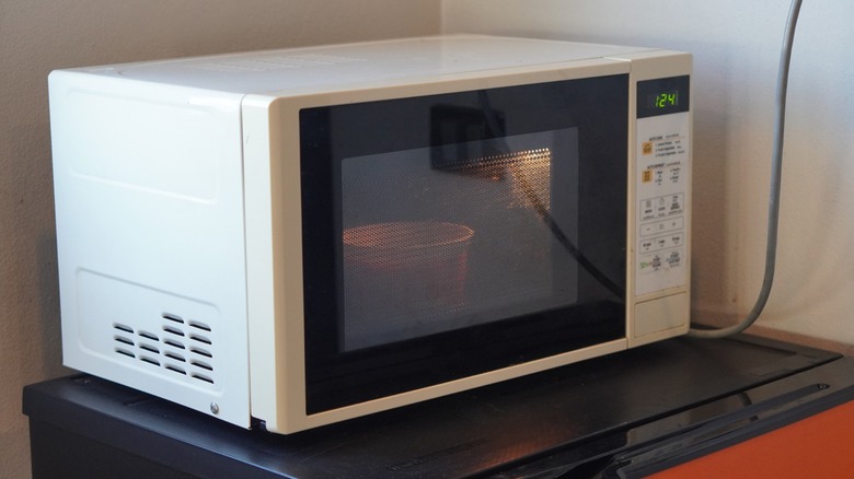a microwave cooks food