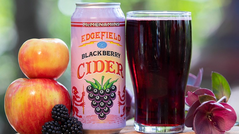 A glass and can of Edgefield Blackberry Cider from McMenamins