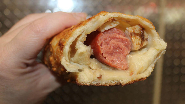 Close up of hot dog inside Costco chicken bake