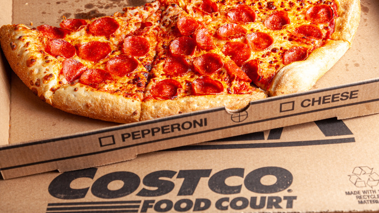 Close up of Costco pepperoni pizza with take out box