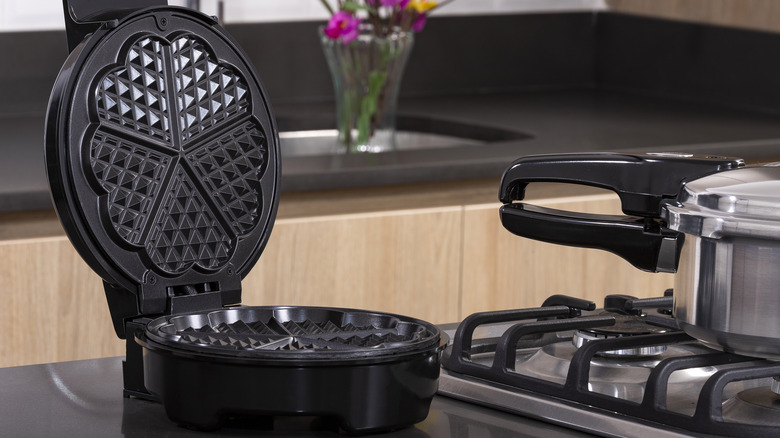 open waffle maker on counter