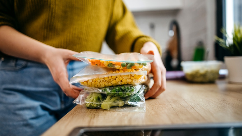 Woman with leftovers in her hands