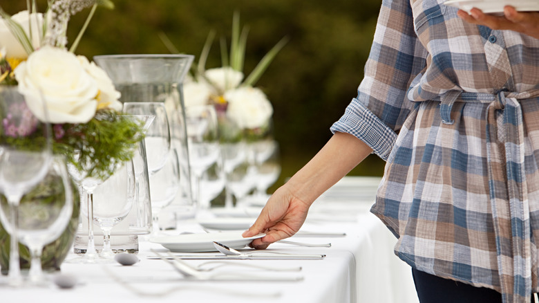 Woman setting the table