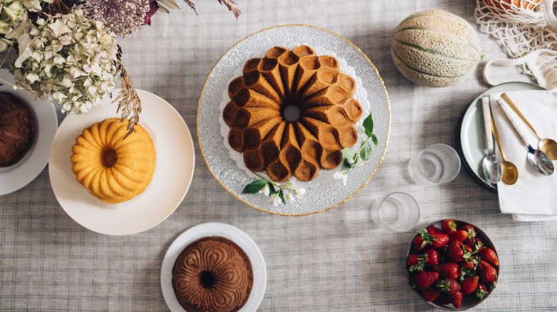 elegant vintage table set up with bundt cakes