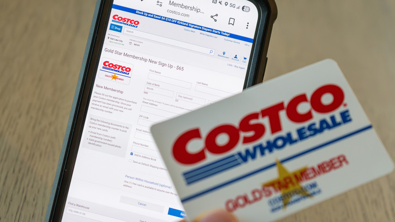 Costco Gold Star member card in front of a phone screen