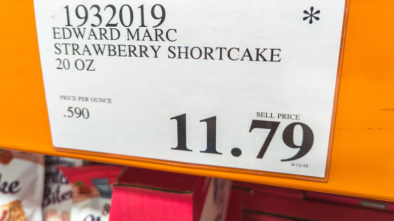 Costco asterisk symbol on an overhead price tag