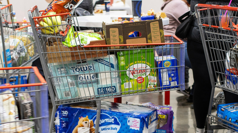 Shopping carts full of groceries at a Costco store