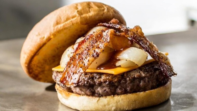 Burger with bacon, onion, and cheese