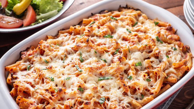 Baked Ziti Pasta with Cheese, Marinara and Basil in a Casserole Dish