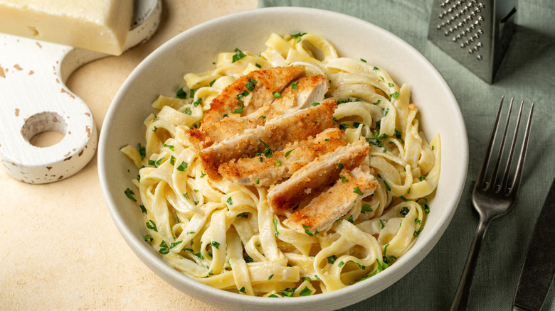 Fettuccine Alfredo with chicken in a white plate