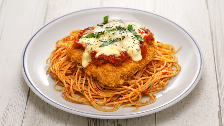 Chicken parm and pasta on plate