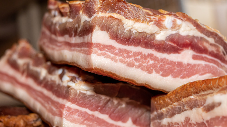Smoked pork bacon on a wooden board