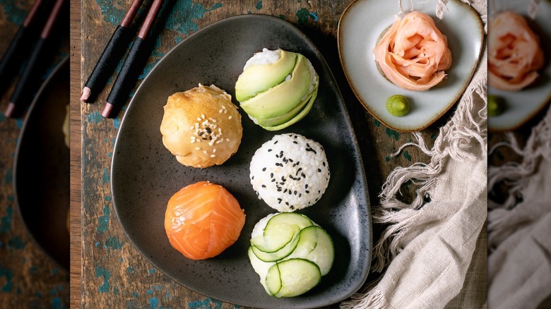 Trendy sushi balls with salmon, avocado, cucumber, and Japanese omelet