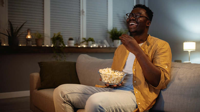 man eating popcorn