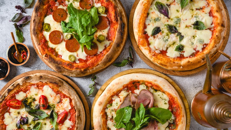 Neapolitan pizzas on grey stone table