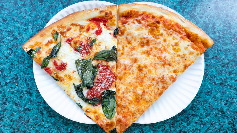 An overhead view of two Margherita and cheese New York City style slices