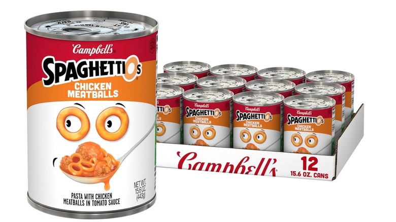 Cans of Campbell's SpaghettiOs with Chicken Meatballs on a white background