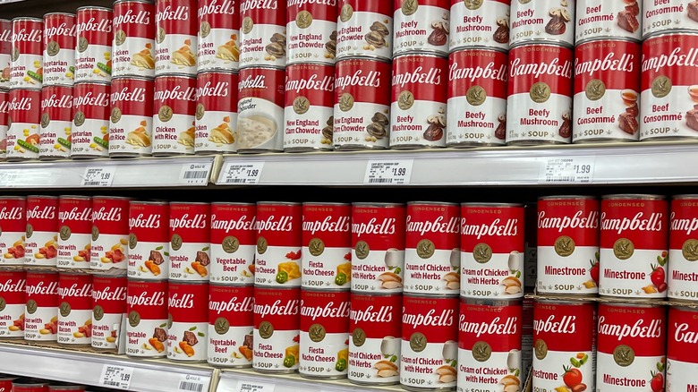 Supermarket shelves lined with tins of Campbell's soups
