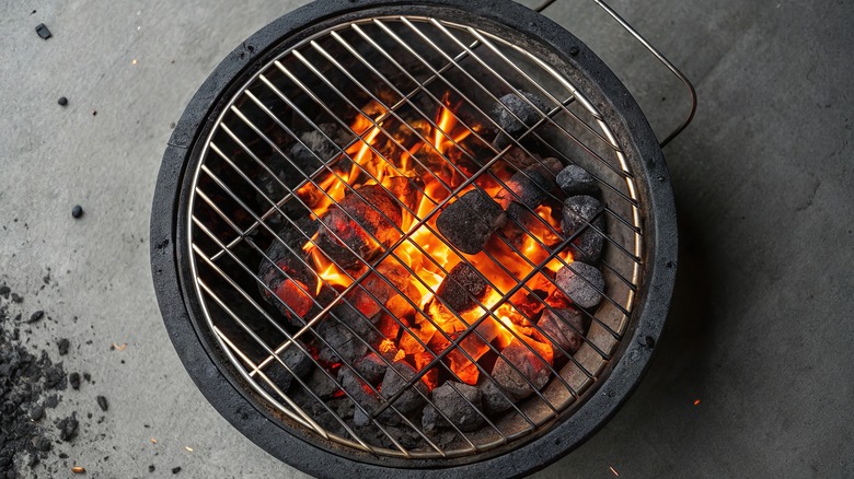 A top-down view of a charcoal grill