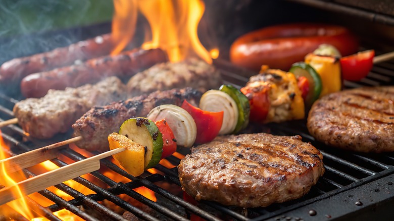 Foods being cooked on a flaming grill