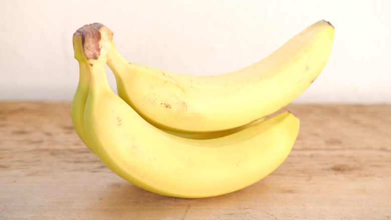 Fresh bananas on wooden table