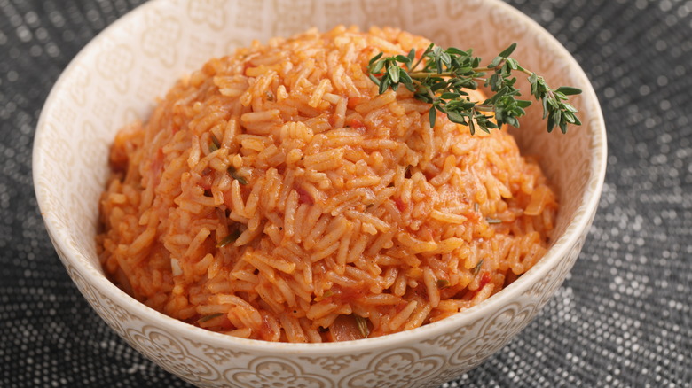 A bowl of Nigerian jollof rice with thyme