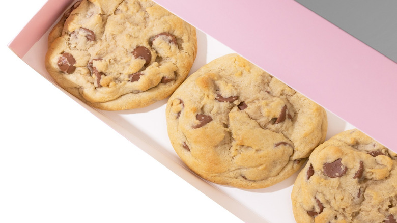 Pink box with three Crumbl Milk Chocolate Chip Cookies