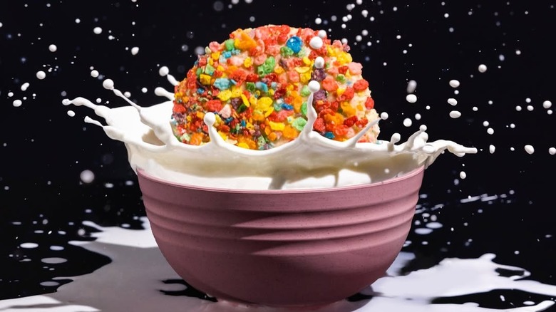 Milk Glaze Ft. Fruity Pebbles cookie dropping into bowl of milk with splashes