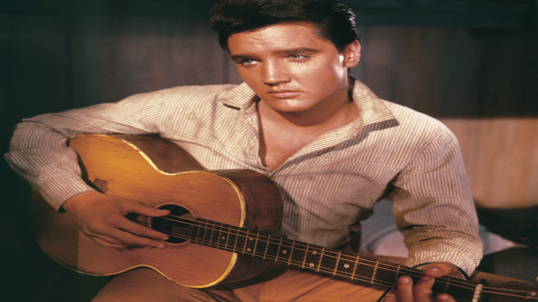 Young Elvis Presley staring